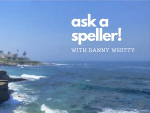 Photo taken outside at the beach. The top half of the photo is of a clear, blue sky while the bottom half is of the blue ocean with some small, breaking waves. White text 'ask a speller! with Danny Whittty'
