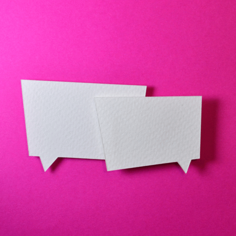 Two white thought bubbles against a pink background.